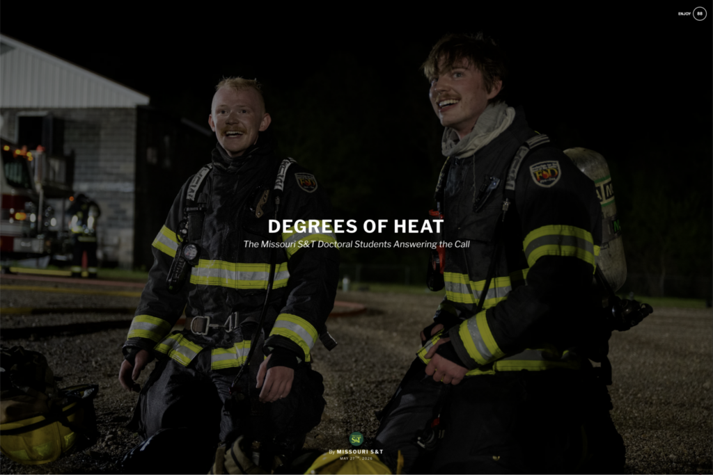 Two firefighters in turnout gear kneel outdoors at night near a fire truck. Overlaid text reads, “Degrees of Heat: The Missouri S&T Doctoral Students Answering the Call.”